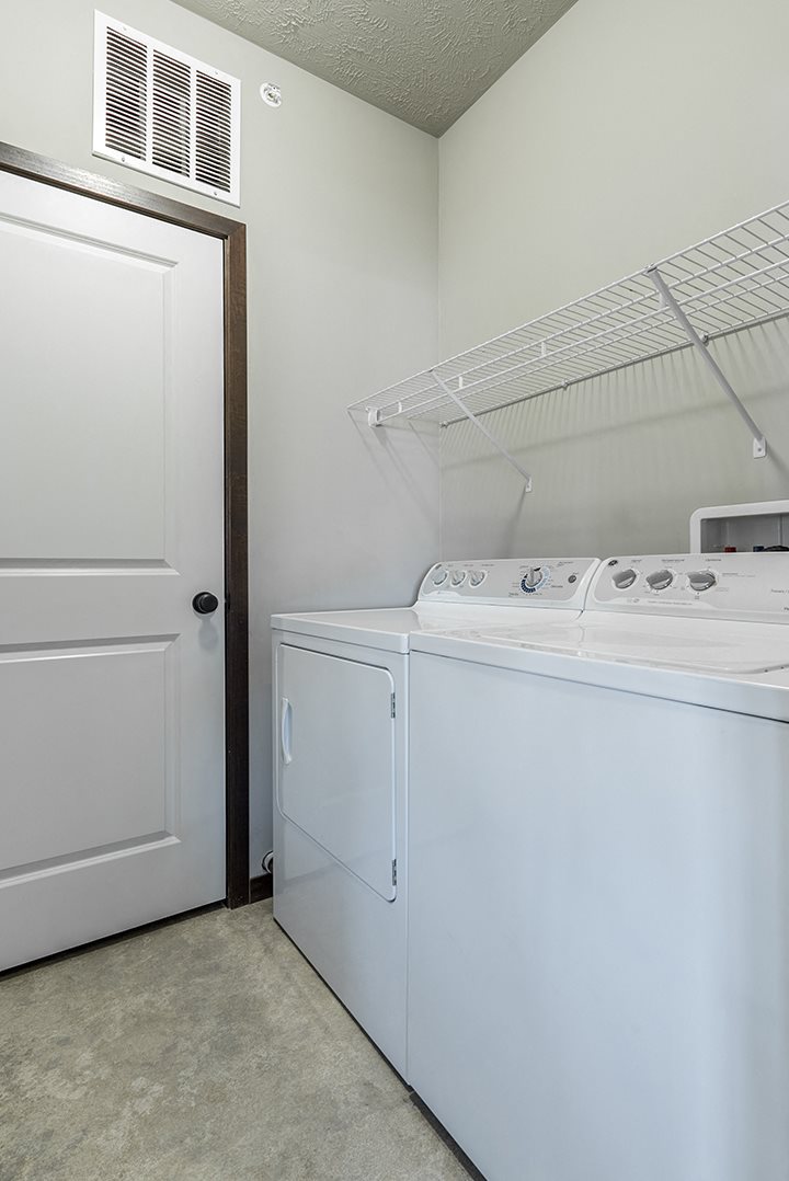 Full-sized washer and dryer in laundry room at the Villas at Wilderness Ridge in Lincoln Nebraska